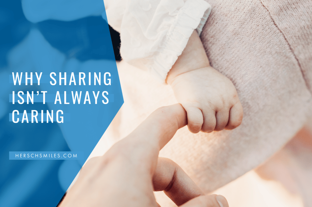 Child holding adult's finger